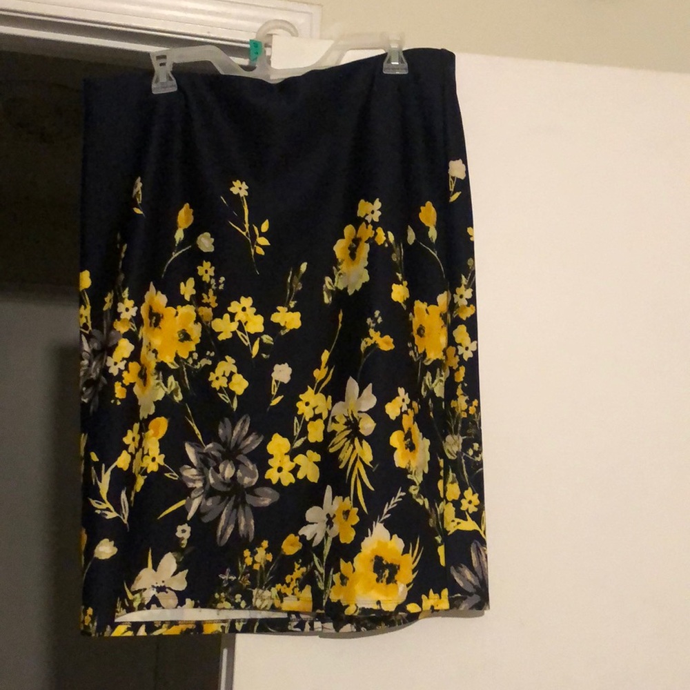Knee length, blue skirt , with added yellow flower accents!